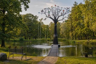 Black-metal and coloured-glass Baltic World Tree sculpture-fountain in the Račiupis pond in Kupiškis