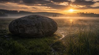 The huge Barstyčiai Stone in a marshy Samogitian valley