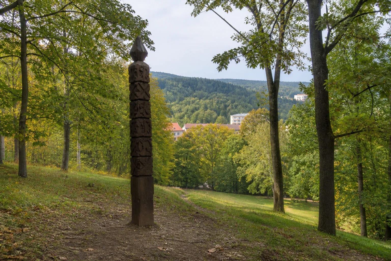 Wooded Bekešo Hill in Kalnų Park with a distant Vilnius panorama