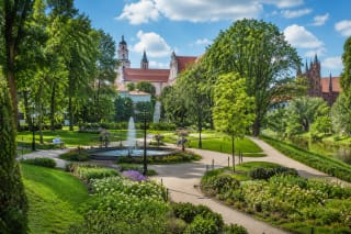Paths, flowerbeds, and fountain in Bernardine Garden in Vilnius Old Town by the Vilnelė