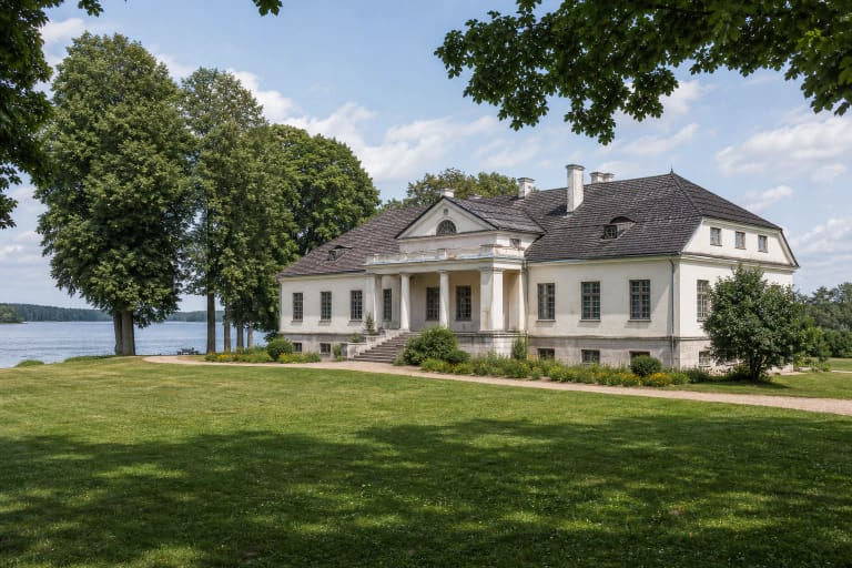 Classical Bikuškis Manor palace on a peninsula by Lake Alaušas