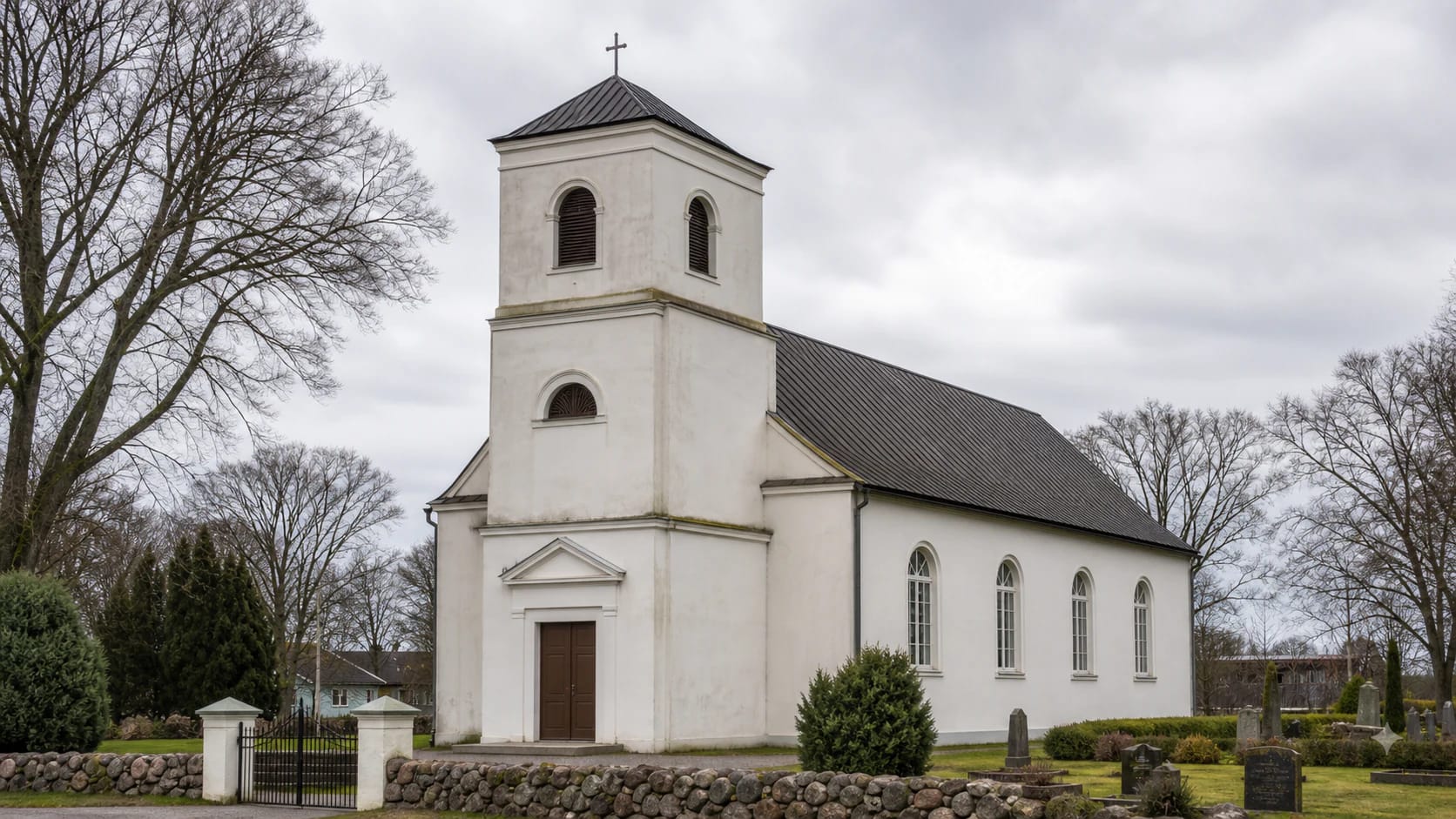 Būtingė Evangelical Lutheran Church with a tower in a seaside village setting