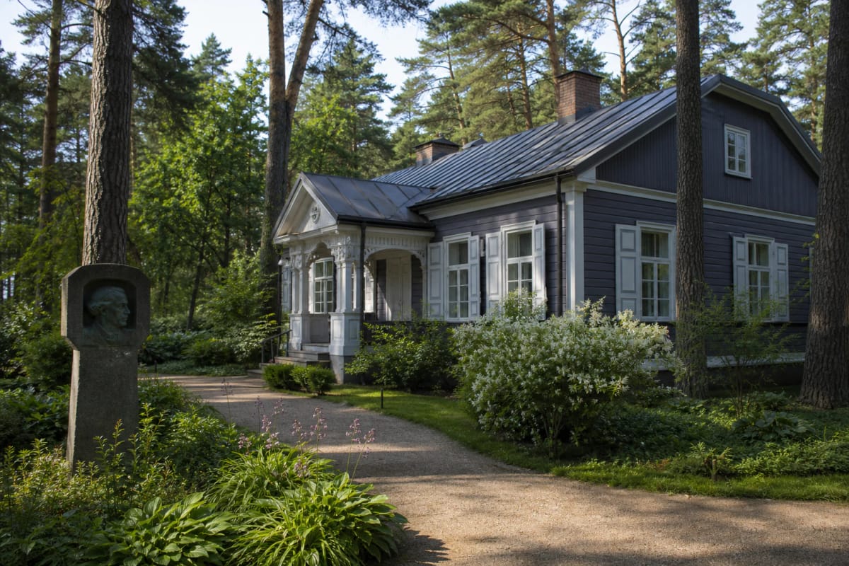 Wooden house of the M. K. Čiurlionis Memorial Museum in Druskininkai with a quiet courtyard