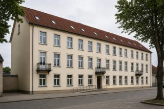 The light three-storey Fridrichas Bajoraitis Library building on Tilžės Street in Šilutė