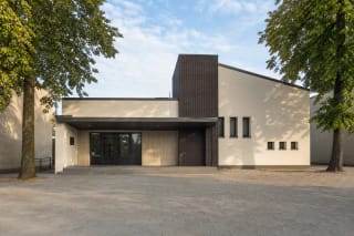 Low modernised Gargždai Minija Cinema facade with a dark clinker accent and entrance canopy