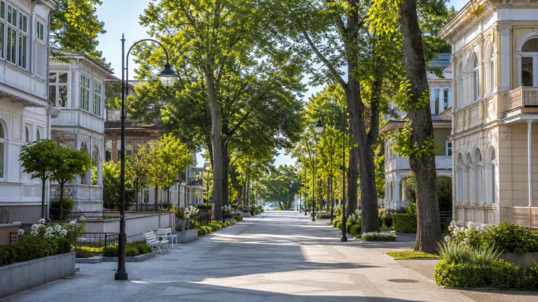 Counts Tiškevičiai Avenue in Palanga with sculptures, lights, and an evening resort atmosphere
