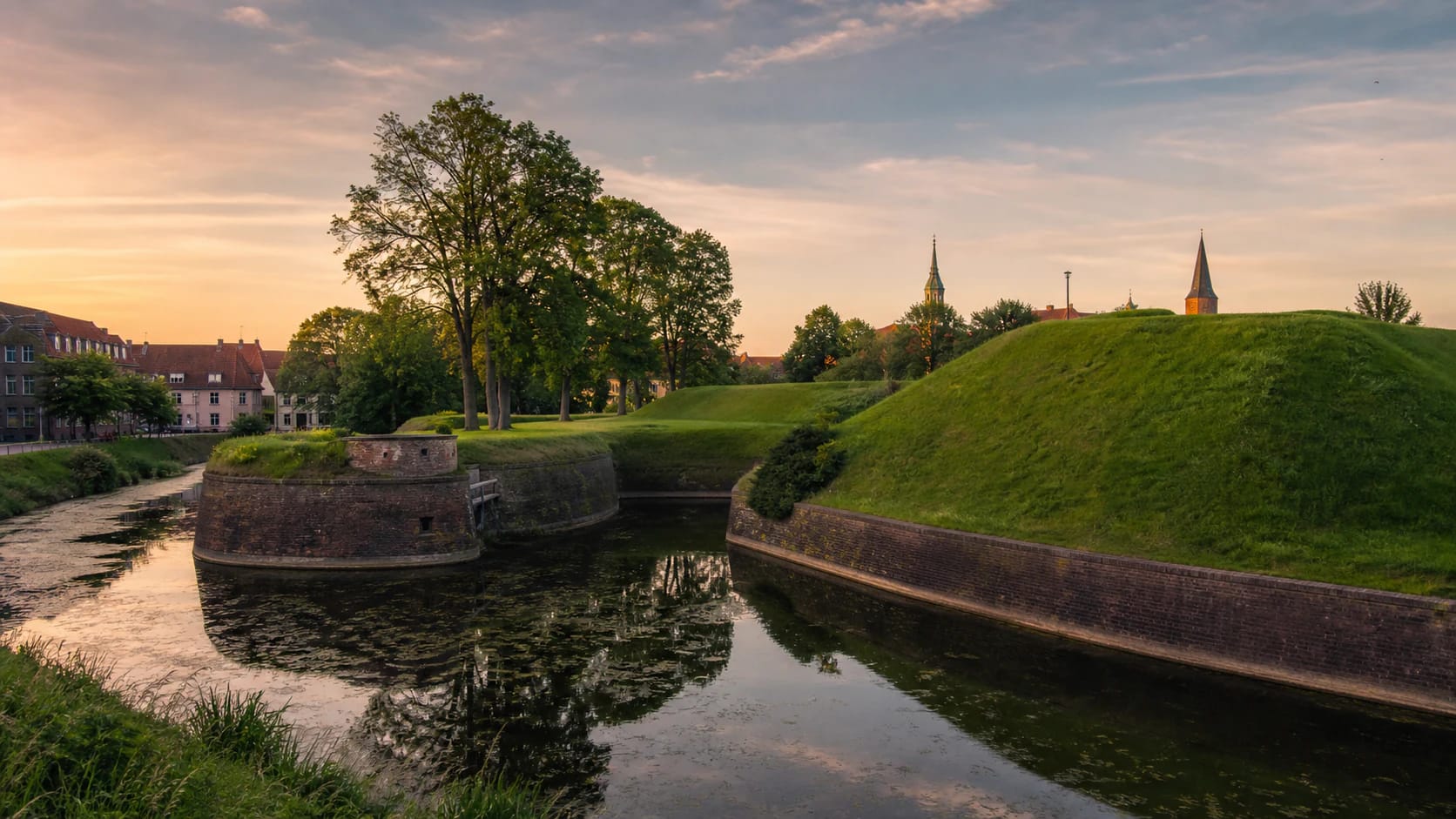 Jono Kalnelis bastion complex in Klaipėda Old Town with water and green slopes