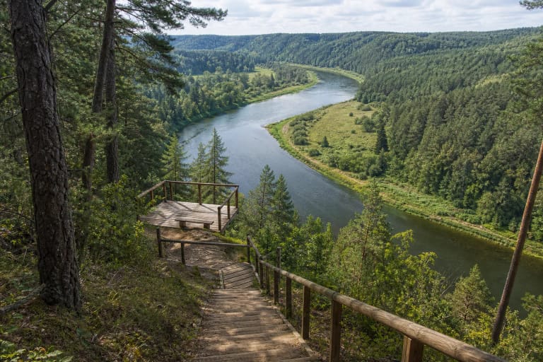 Karmazinai Nature Trail descending over a Neris scarp toward the winding river