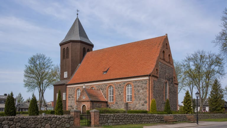 Katyčiai Evangelical Lutheran Church with fieldstone and brick masonry and a wooden tower