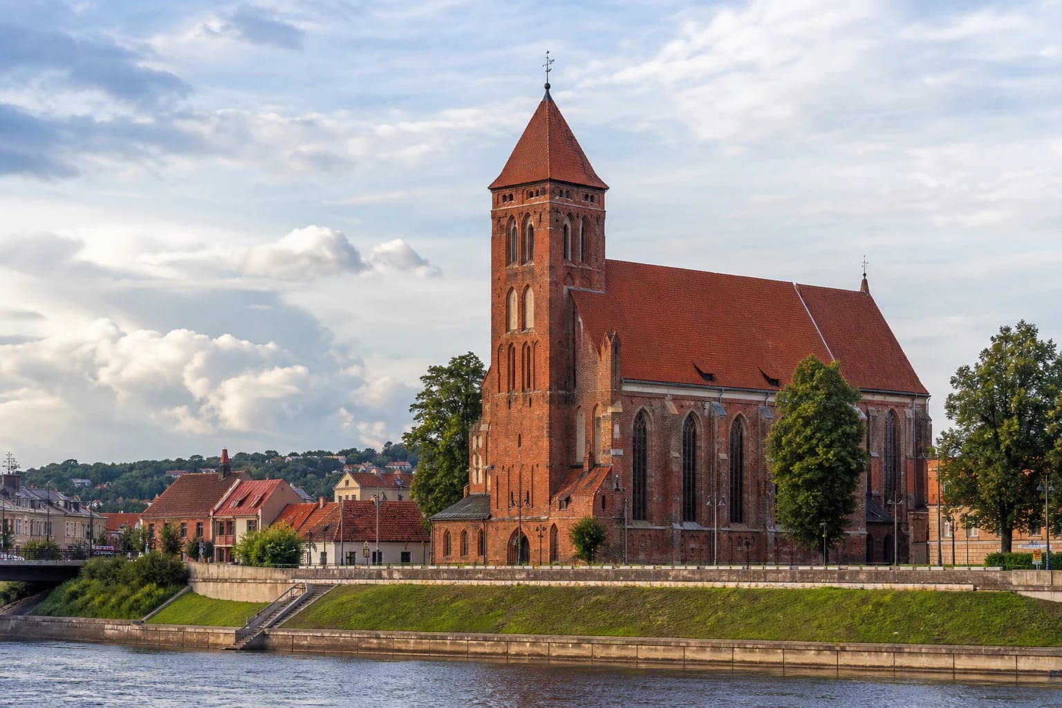 Red-brick Gothic tower of Vytautas the Great Church in Kaunas on the bank of the Nemunas