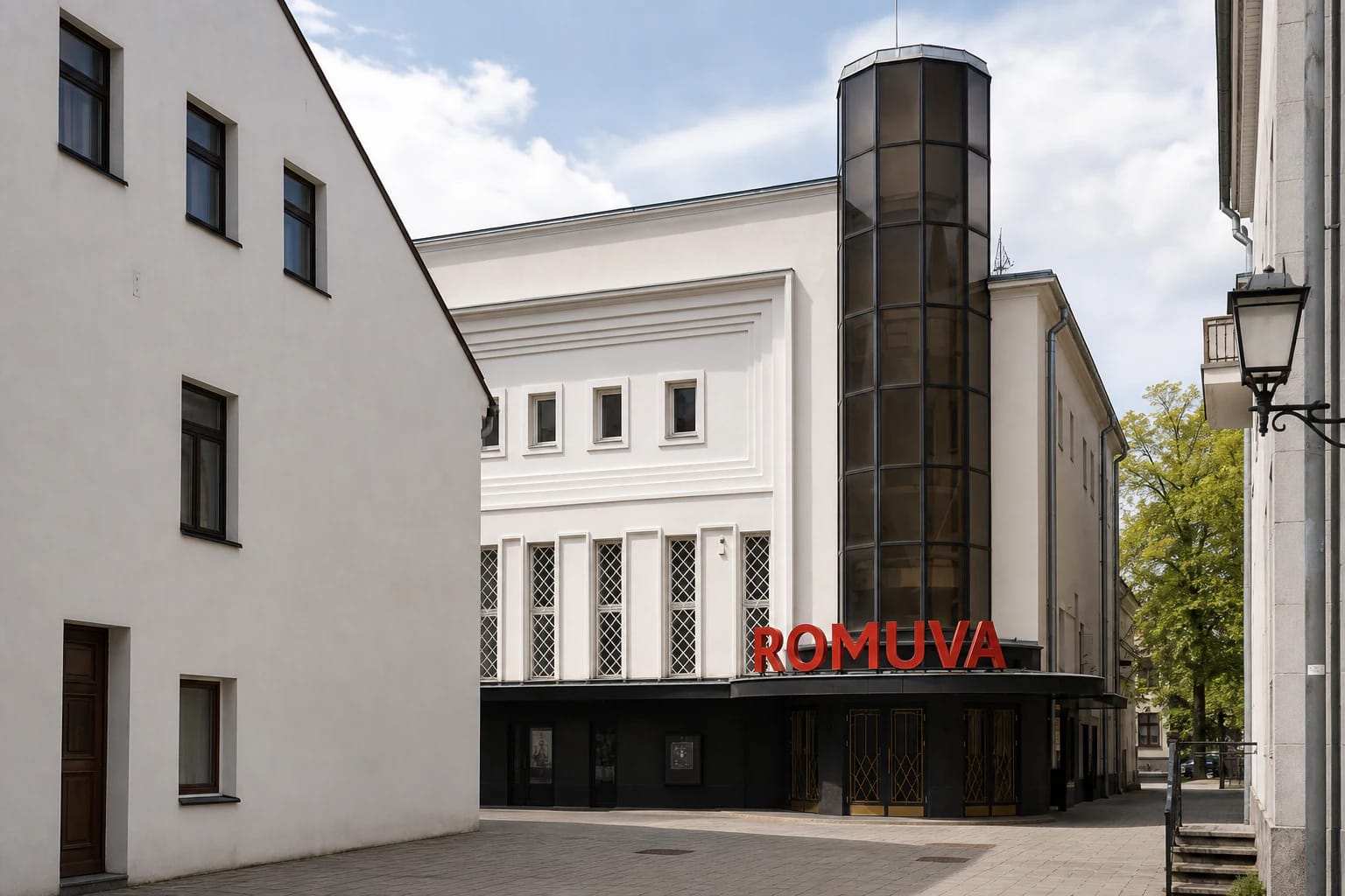 Facade of Romuva Cinema with a glass tower on Laisvės alėja in Kaunas