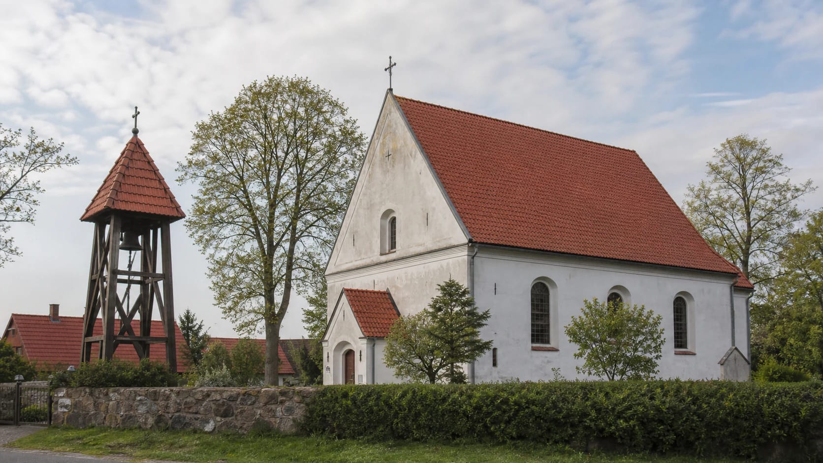 Kintai Evangelical Lutheran Church with a red-tile roof and separate belfry