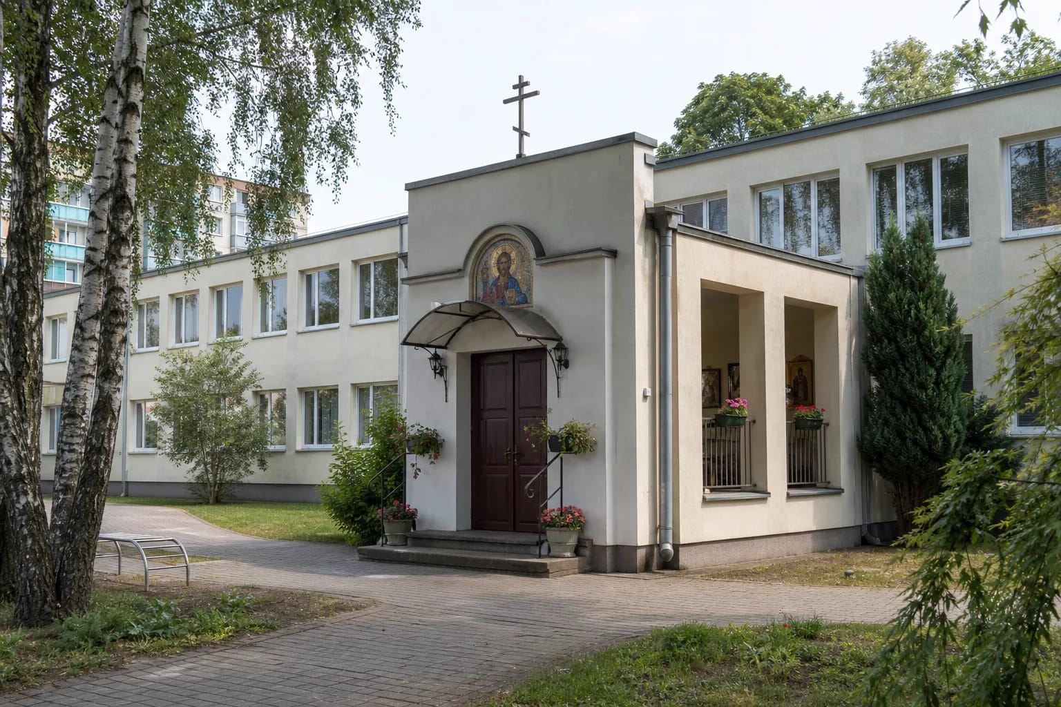 Entrance to the Orthodox Church of Faith, Hope, Love and Sophia in a Klaipėda school wing with a Christ Pantocrator mosaic