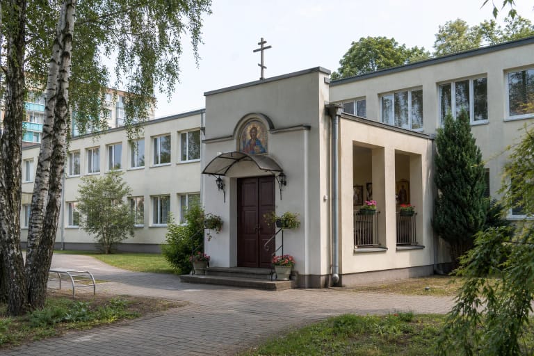 Entrance to the Orthodox Church of Faith, Hope, Love and Sophia in a Klaipėda school wing with a Christ Pantocrator mosaic