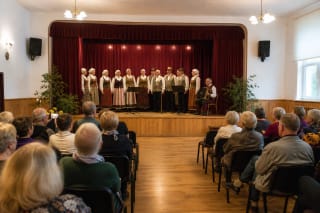 Kretingalė Culture Centre hall with local folk performers on stage