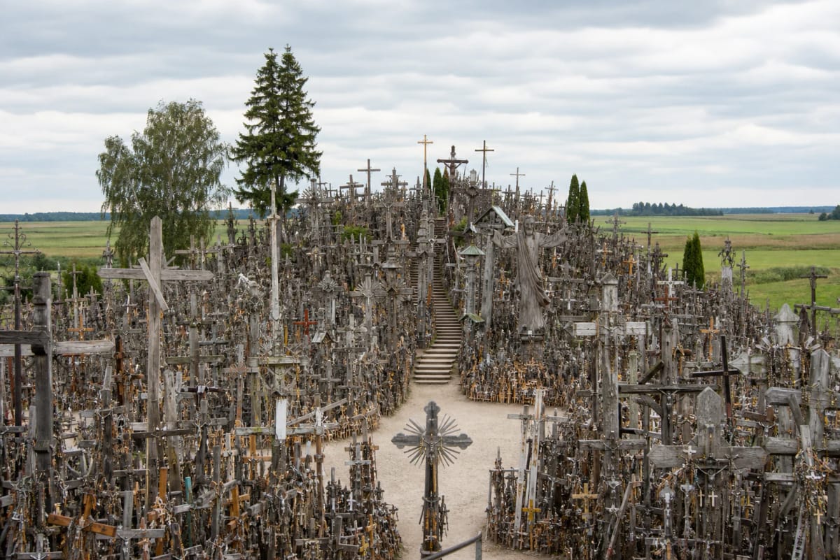 Hill of Crosses densely covered with wooden and metal crosses on Jurgaičiai Hillfort