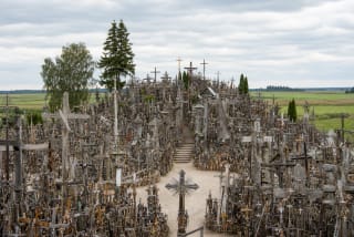 Hill of Crosses densely covered with wooden and metal crosses on Jurgaičiai Hillfort