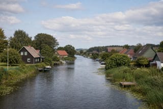 Mingė Village homesteads on both banks of the Minija River in the Nemunas Delta landscape