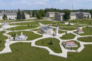 White paths forming Lithuania's outline and architectural models on plinths in Ukmergė's Mini Lithuania park