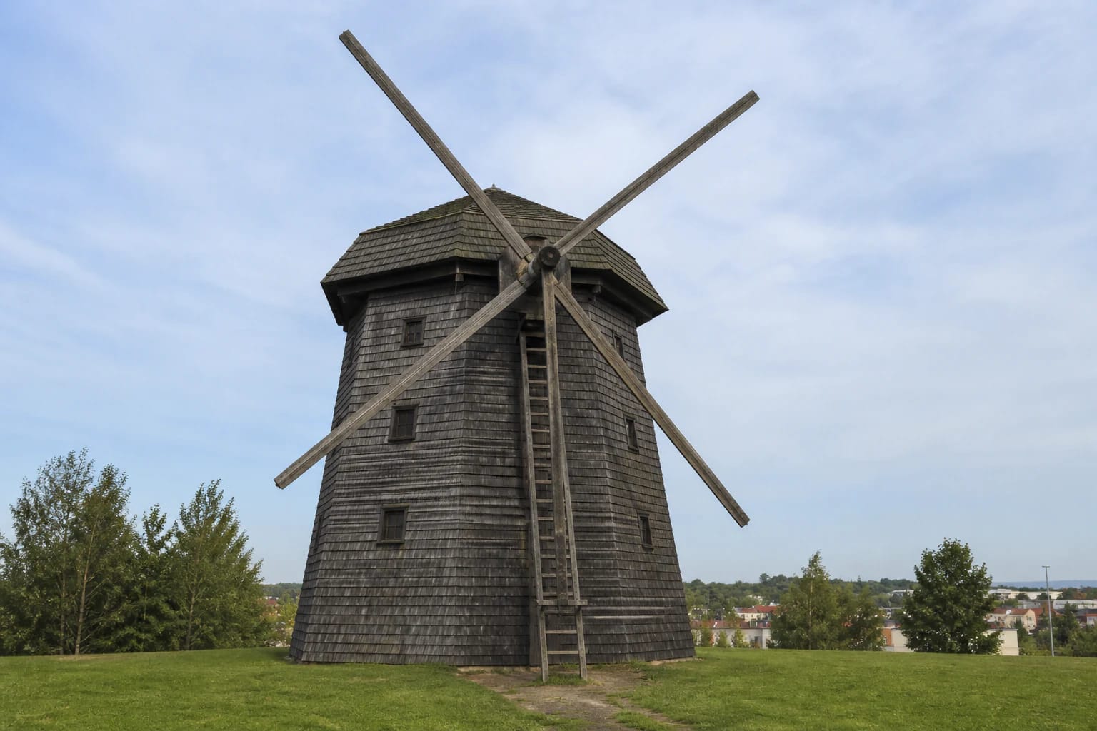 Restored Pilaitė Windmill with four sails on a green hill