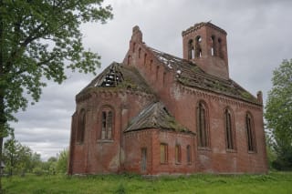 Ruined red-brick Plaškiai Evangelical Lutheran Church