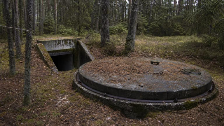 Concrete silo cover of Plokštinė Missile Base in the forest by the Cold War Museum