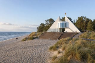 Preila Beach lifeguard station and stepped terrace among grassy Curonian Spit dunes beside the Baltic Sea