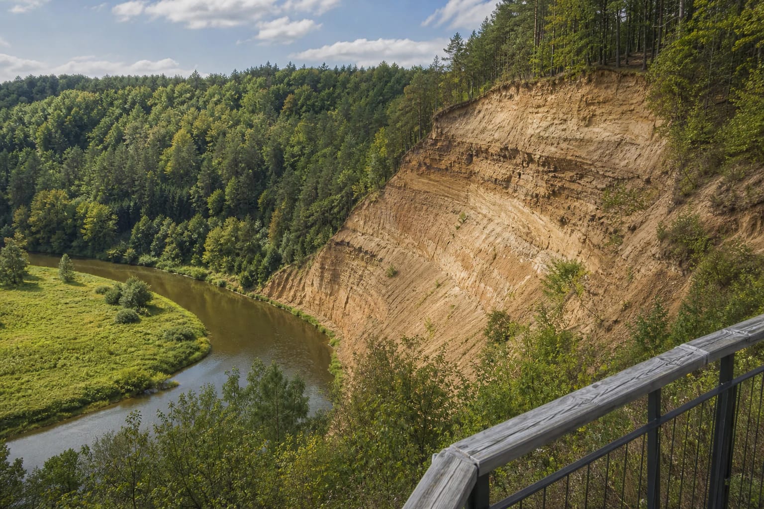 Layered cliff of Pūčkoriai Outcrop and the Vilnia River valley