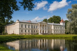 Rokiškis Manor palace with Classical facade, park, and pond landscape