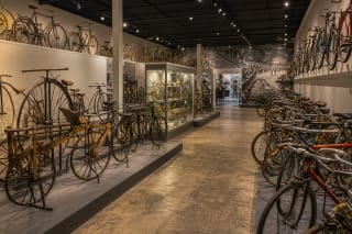 Historic and modern bicycles displayed inside the Šiauliai Bicycle Museum