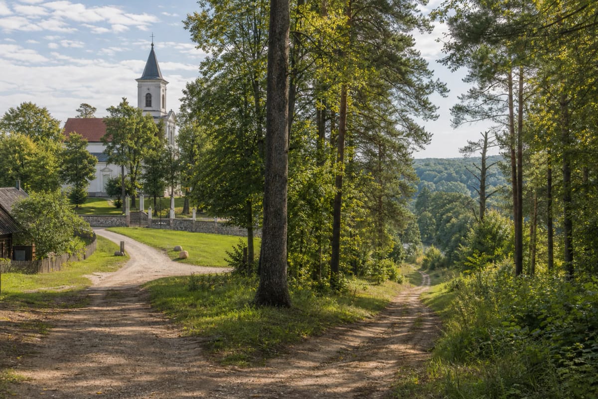 Šilėnai Nature Trail with a village edge, forest road, and green landscape of Neris Regional Park