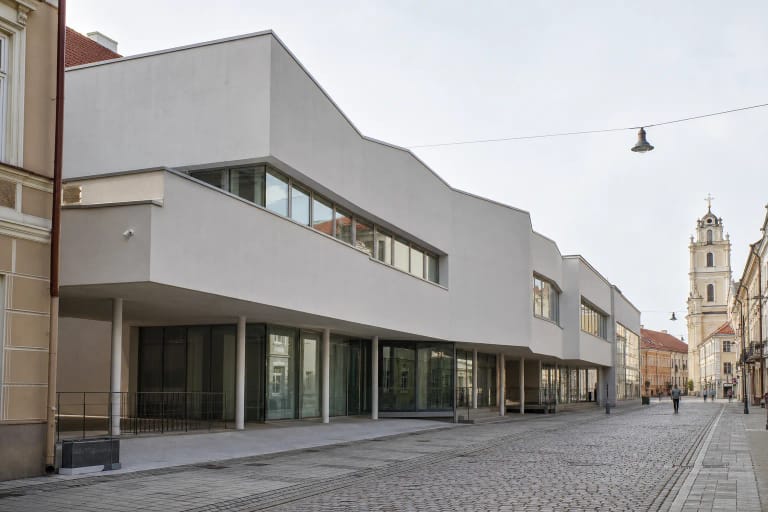 White faceted Contemporary Art Centre building with a glazed ground floor in Vilnius Old Town