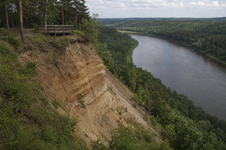 Škėvonys Exposure above a Nemunas bend with forest, layered bluff, and viewpoint railings