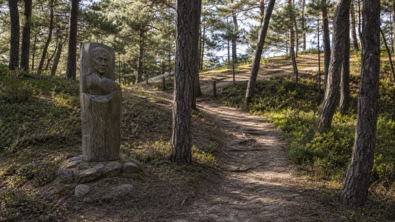 Liudvikas Rėza sculpture near Skirpstas Hill in the Pervalka lagoon and pine setting
