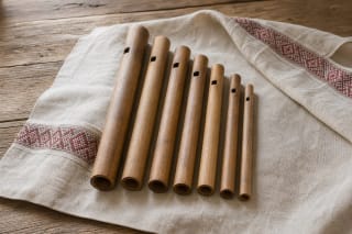 Wooden skudučiai on linen as a Lithuanian folk wind instrument