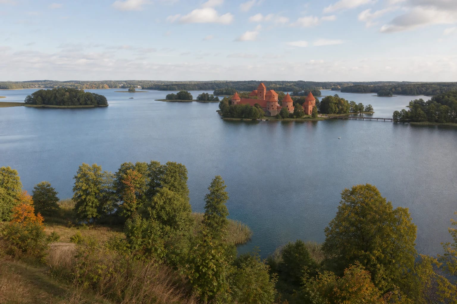 The Island Castle among Lake Galvė islands and wooded shores of Trakai Historical National Park
