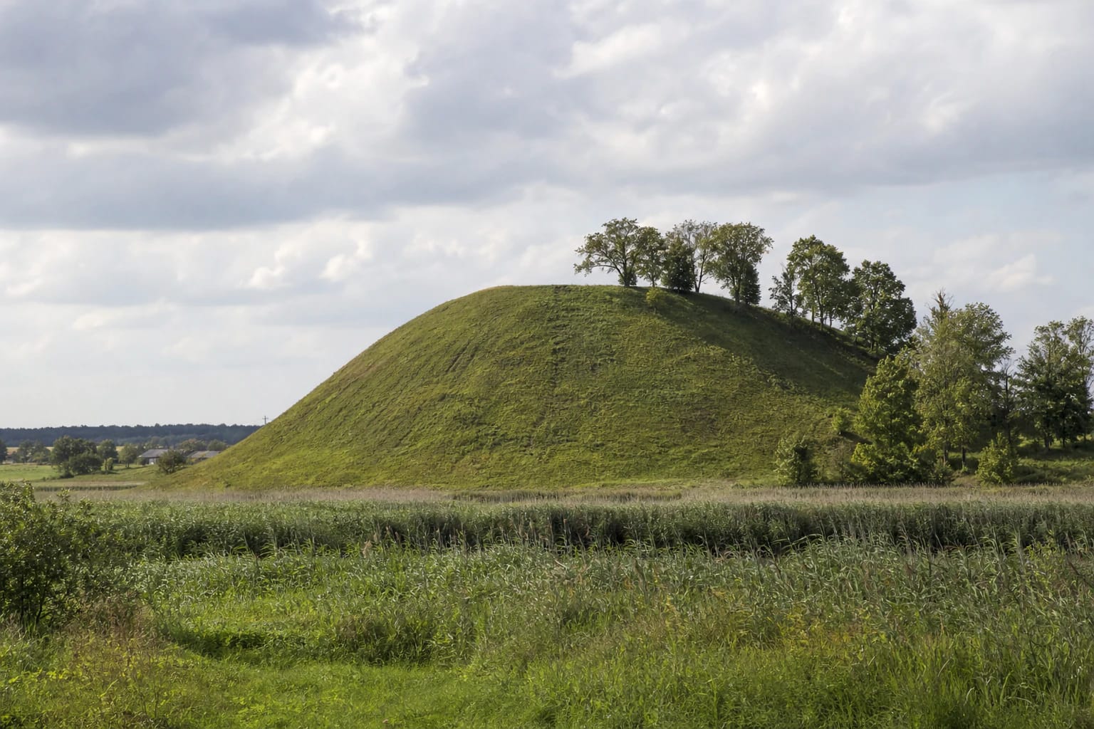 Steep slopes and platform of Upytė Hillfort among former marshlands