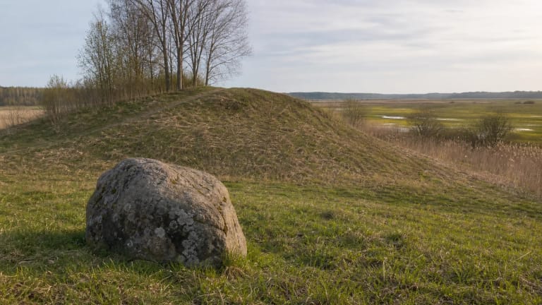 Green hill of Varnupiai Hillfort and the mythological Padkavinis stone in the Žuvintas Biosphere Reserve landscape