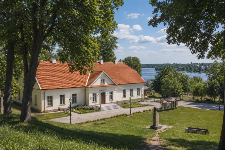 Veisiejai manor setting and regional museum building among greenery in the lake town