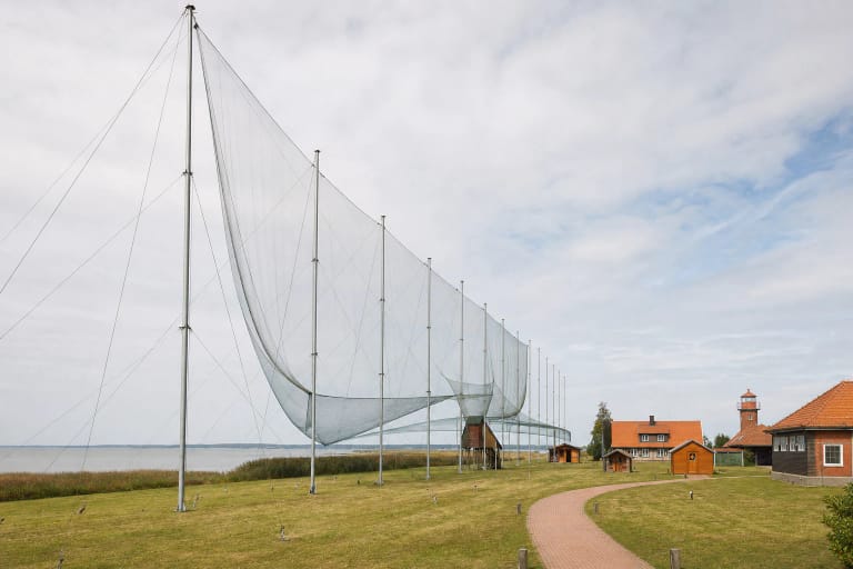 The giant net bird trap of Ventė Cape Ornithological Station on tall metal poles beside the Curonian Lagoon