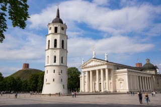 Vilnius Cathedral and separate bell tower in Cathedral Square with Gediminas Hill behind