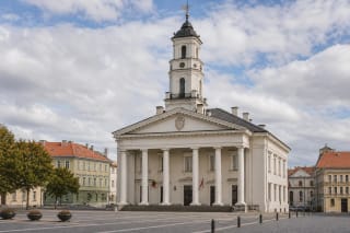 Classical facade of Vilnius Town Hall with a Doric portico on Town Hall Square in the old town