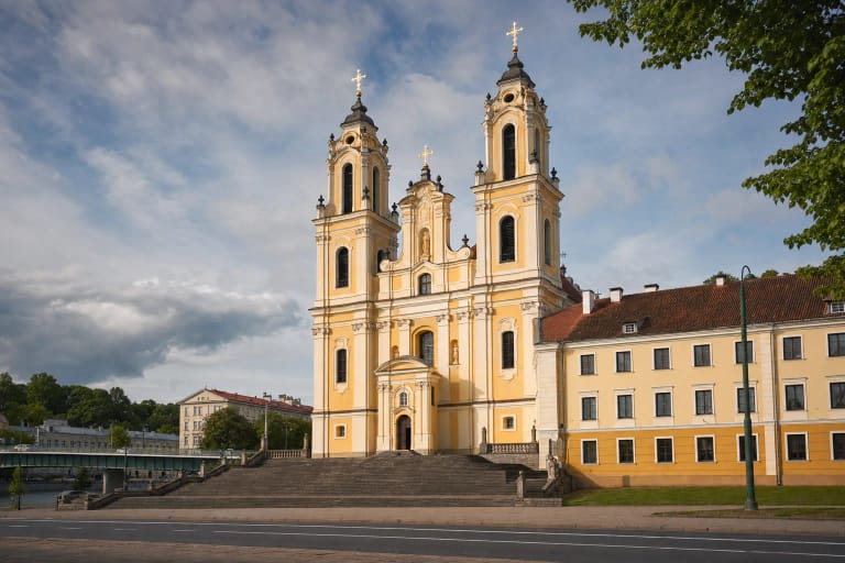 White twin-towered late-Baroque Church of St Raphael in Šnipiškės beneath a blue sky