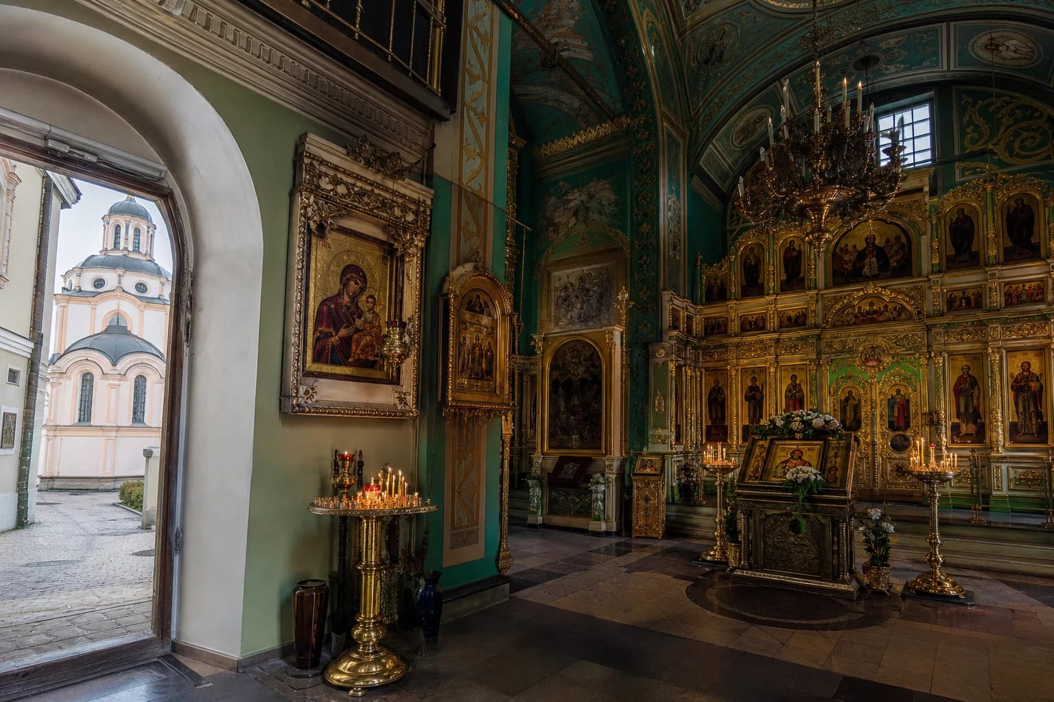 Interior of Vilnius Holy Spirit Orthodox Church with iconostasis, candles, and Baroque spatial details